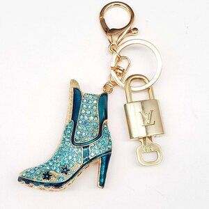Authentic Louis Vuitton Lock & Key with unbranded Boots Bagcharm, Keycharm
